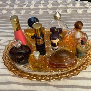 Vintage Parfum Bottles.  Some are filled, some are empty.  There are 10 bottles…